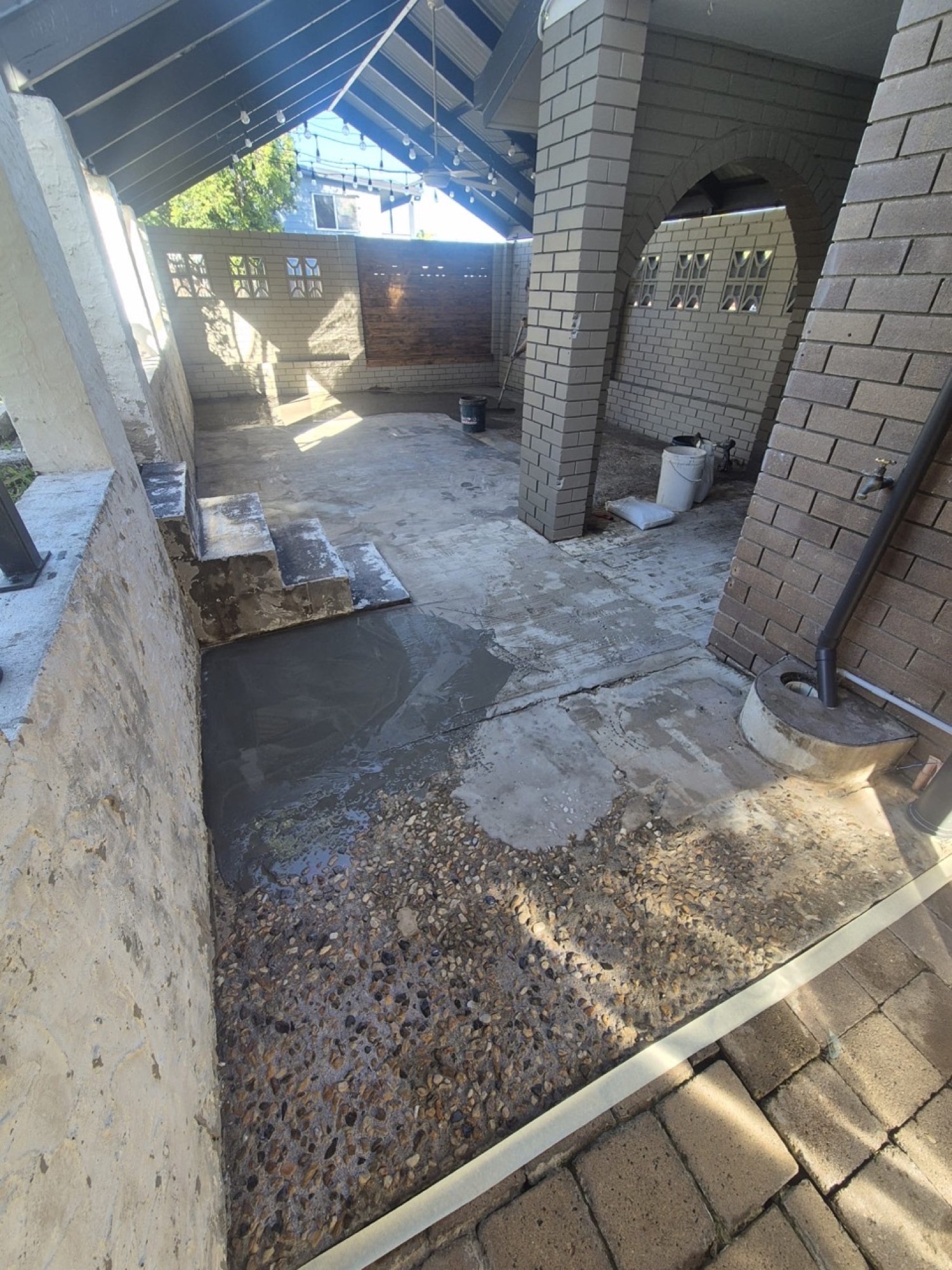 Before: worn patio concrete