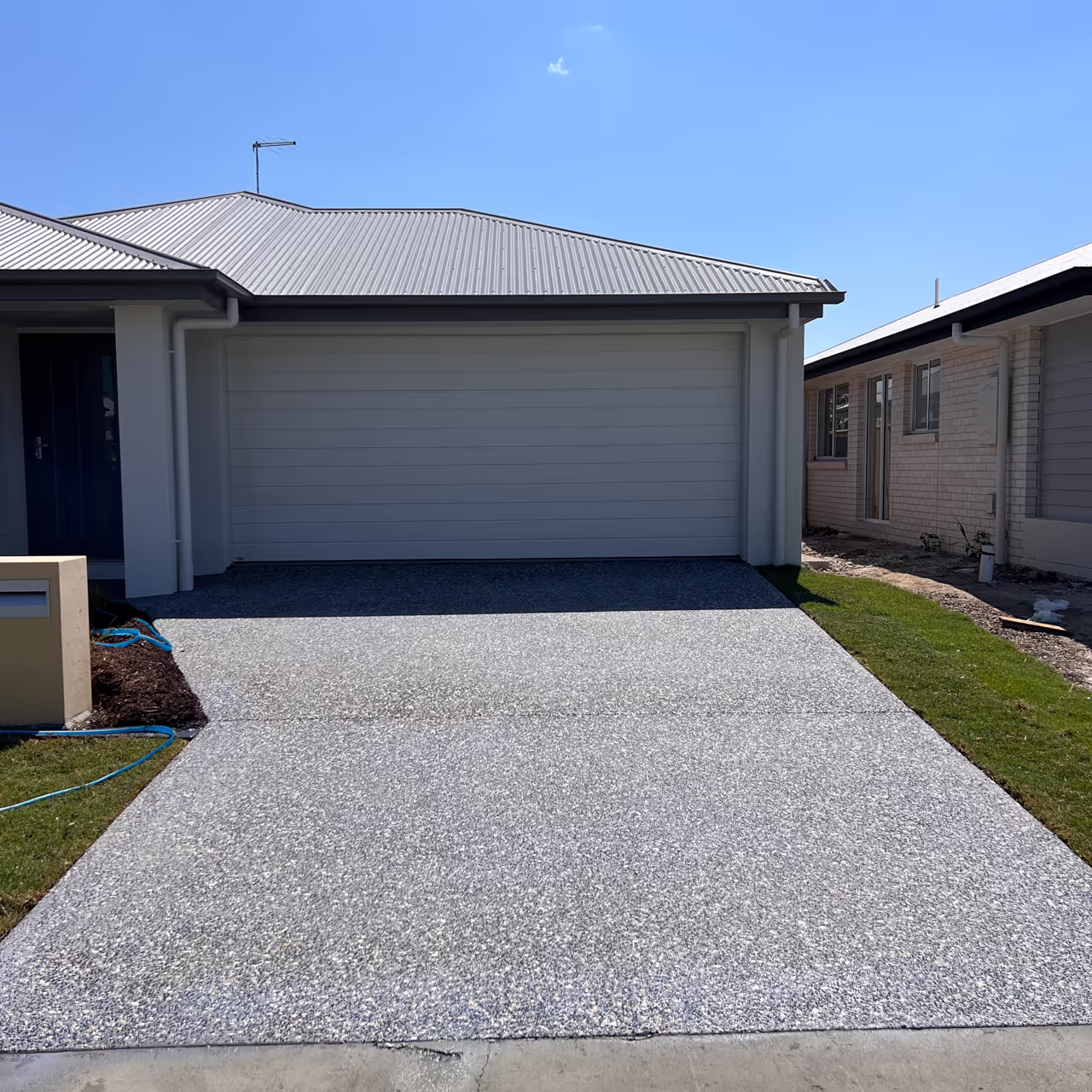 Inspire home with sealed driveway viewed from the street