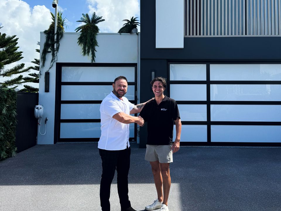 CoatPro handing over a finished dark grey driveway to the owner